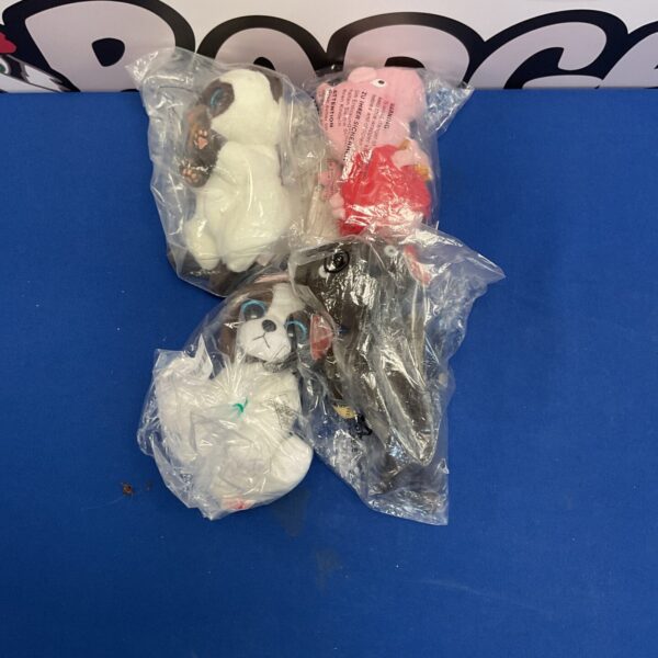 Sealed Ty Beanie Babies lot of four plush toys.