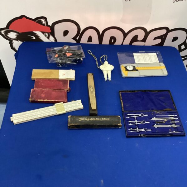 Vintage drawing tools and slide rule for technical drawing.