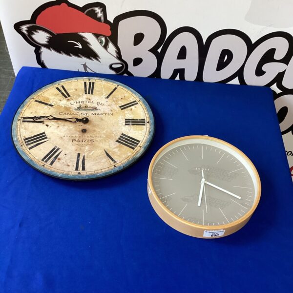 Pair of vintage wall clocks, including a Jones clock, for retro decor.