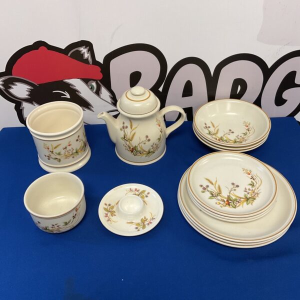 Vintage St Michael Harvest tableware set on display.