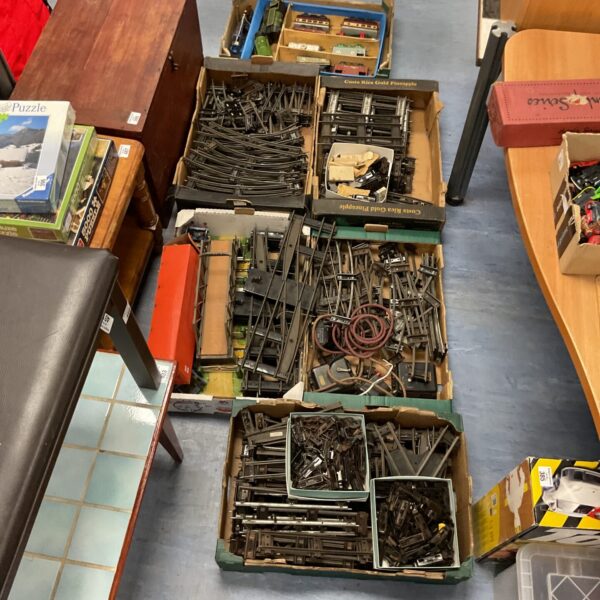 Overview of a large vintage O gauge train set collection in boxes.
