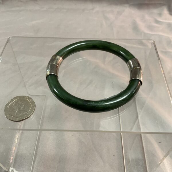 Vintage spinach jade bracelet, a classic bangle style.