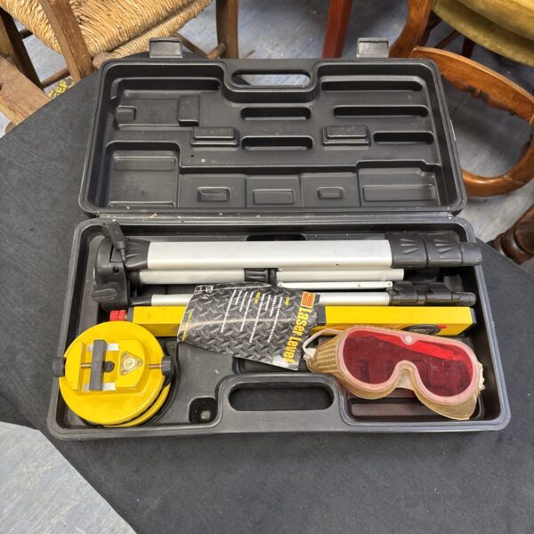 Power Master laser level set in a hard case with tripod.