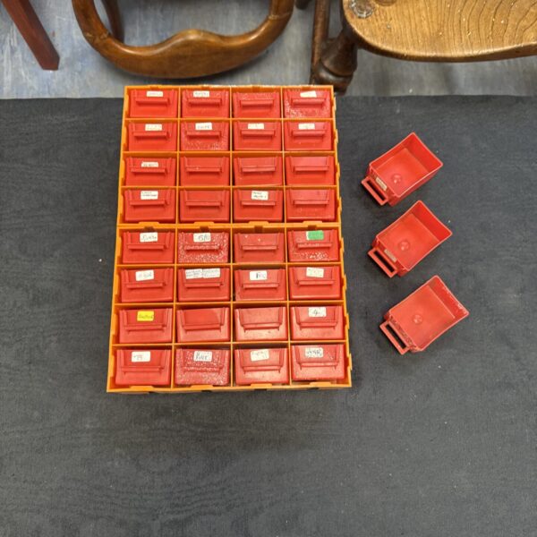 Red plastic engineers drawers for workshop storage and organisation.