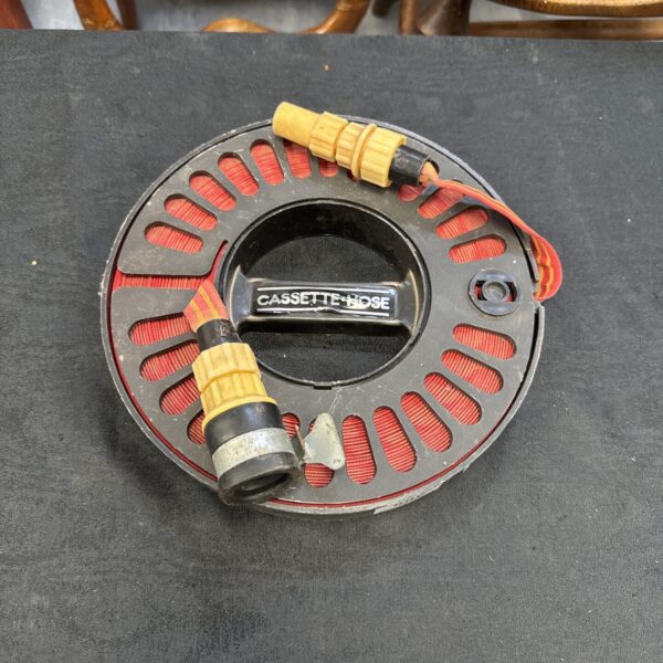 Close-up of a vintage cassette hose with ribbed detailing.