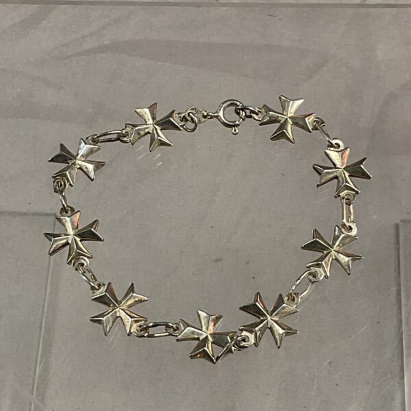 Vintage silver Maltese cross bracelet, detailed craftsmanship.