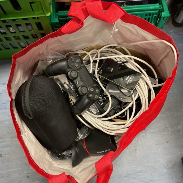 Mixed lot of PS4 controller and various cables for multiple devices.