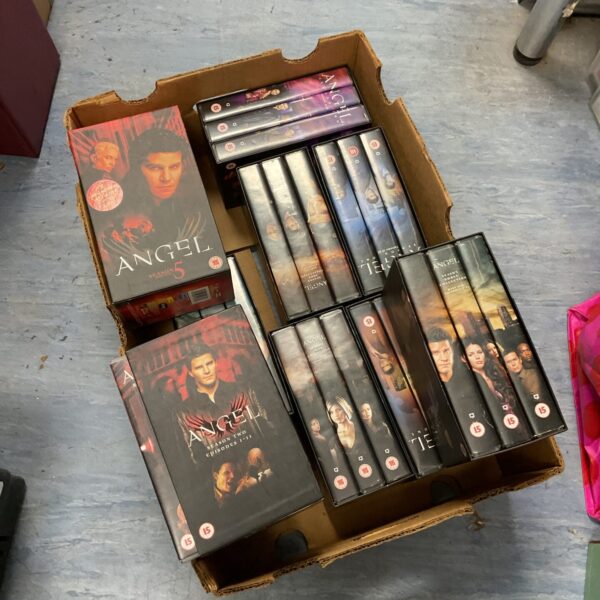Collection of vintage *Angel* VHS boxsets for collectors.