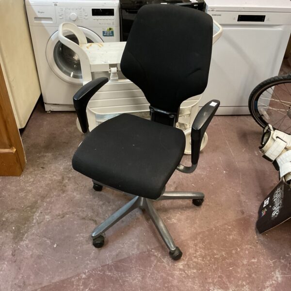 Black office swivel chair in used condition.