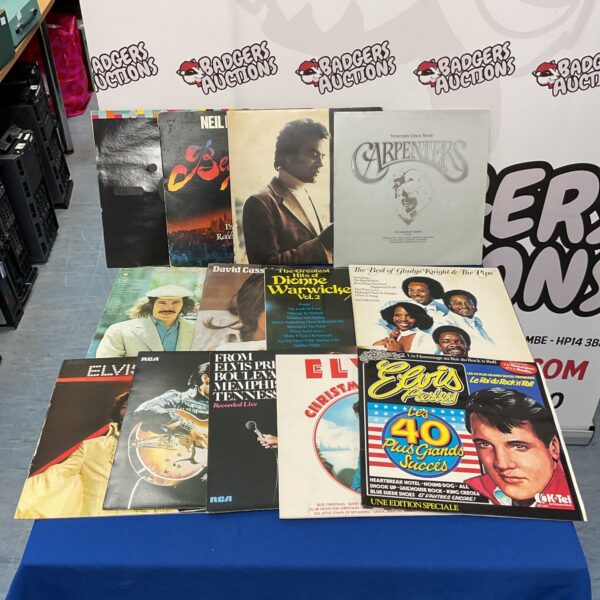 Vintage vinyl record lot featuring Elvis Presley and The Carpenters.