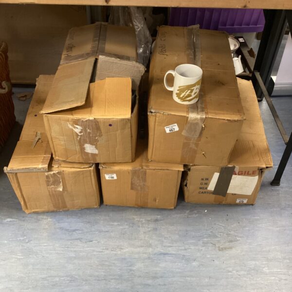 Stack of five boxes containing branded mugs, bold & NEC logos.