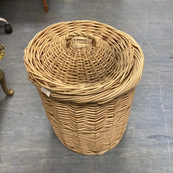 Large vintage wicker wash basket for laundry or storage.