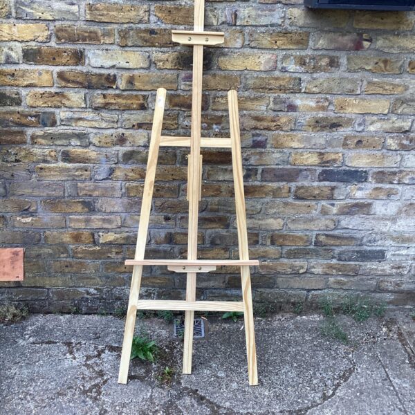 Wooden artist easel for painting and display.
