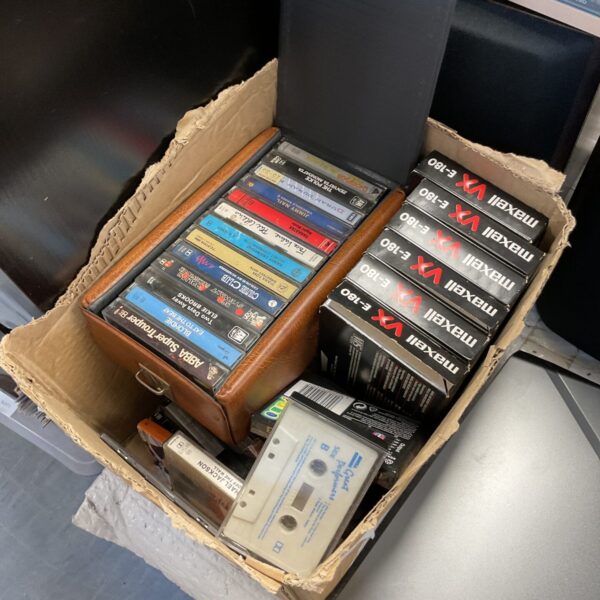Mixed lot of vintage VHS tapes and audio cassettes, including Michael Jackson.