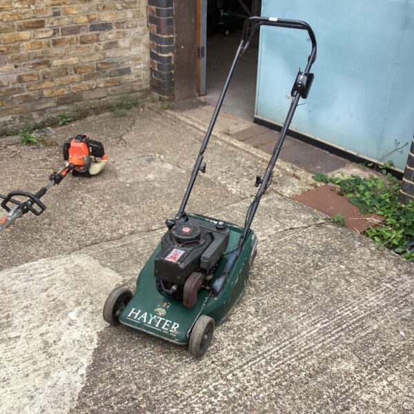 Vintage Hayter Harrier 41 lawn mower in garden setting