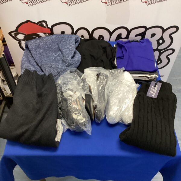 Mixed clothing lot including t-shirts, shoes and jumpers.