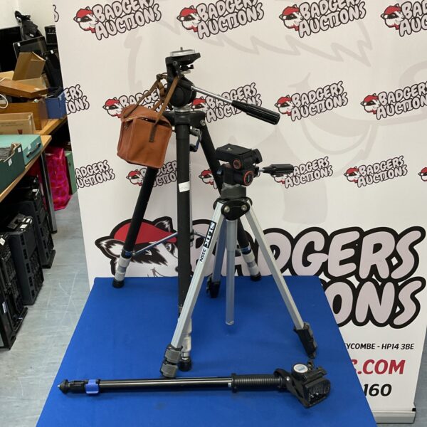 Vintage camera tripods and Kodak box camera for photography.