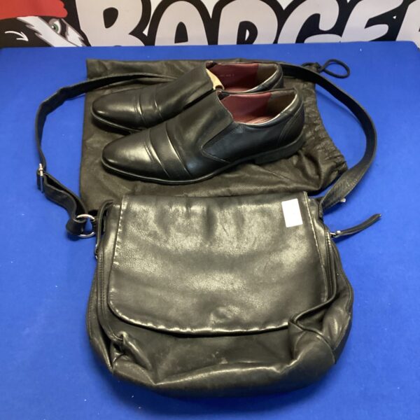 Black leather satchel bag and Claudio Conti men's shoes on display.