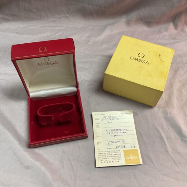 Vintage Omega watch box and papers, a collectible for enthusiasts.