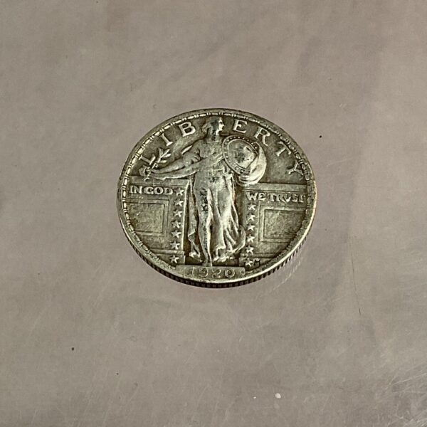 Obverse of a 1920 Standing Liberty Quarter silver coin.