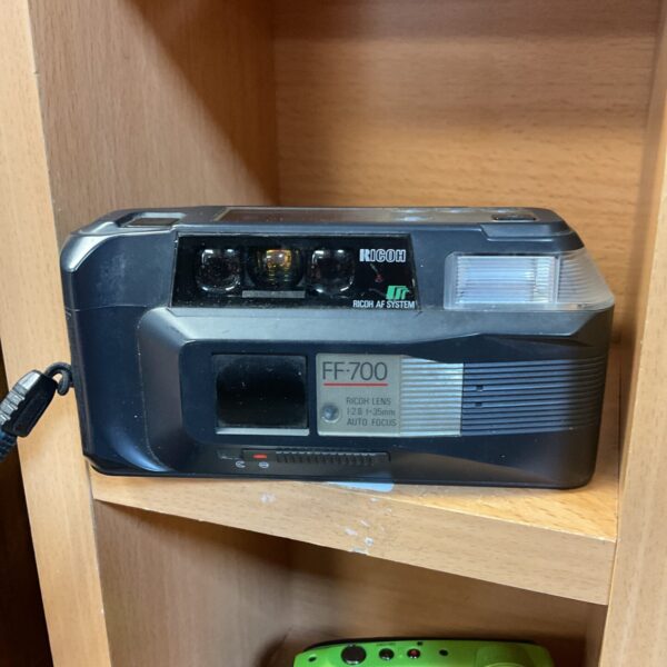 Vintage Ricoh FF-700 35mm film camera, compact point and shoot.
