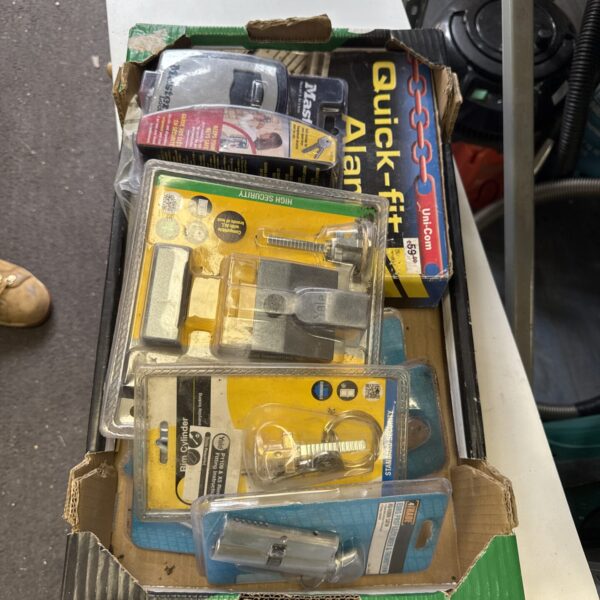 Assorted vintage locks and a Quickfit alarm system in original packaging.