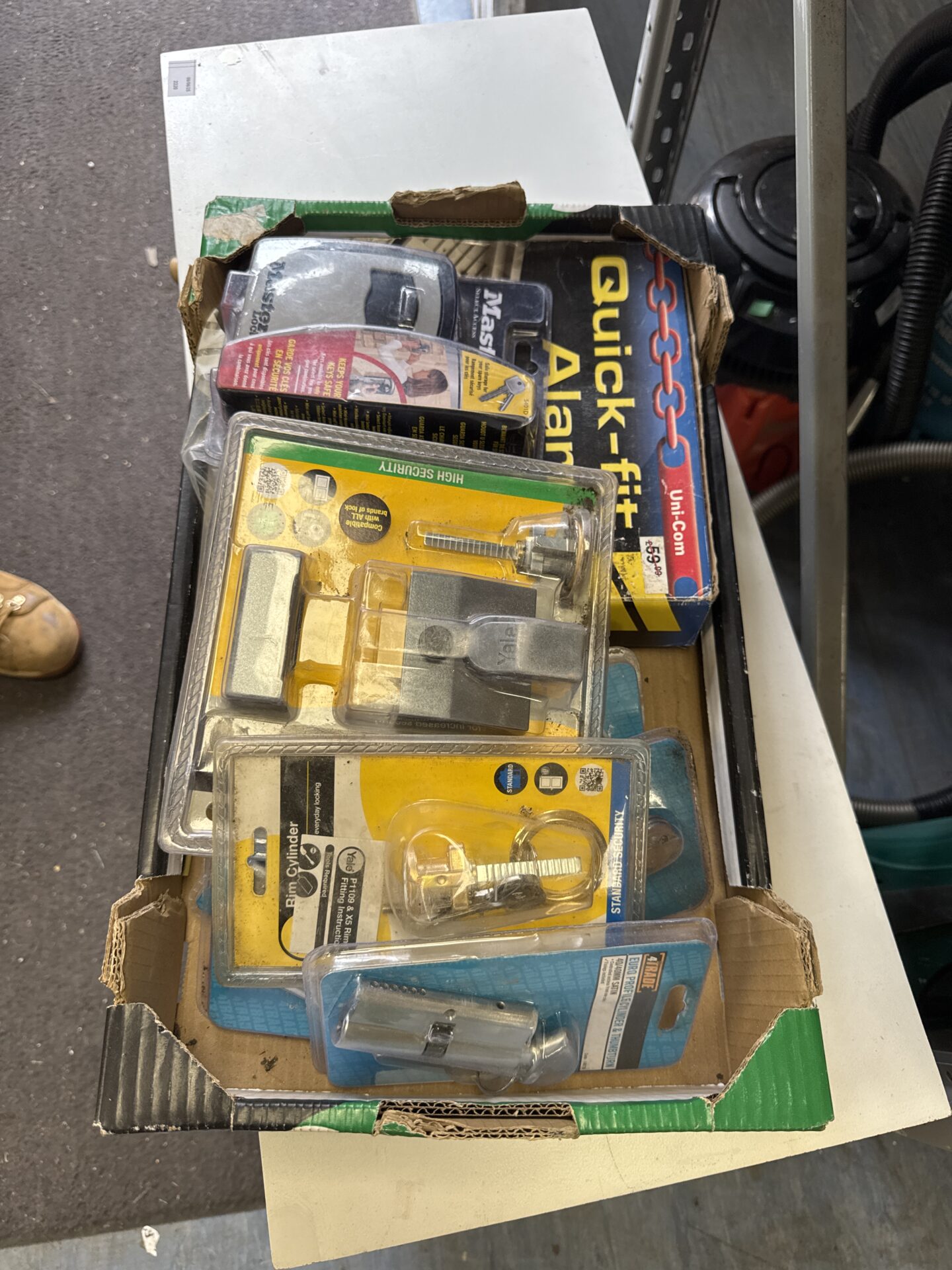 857 Box of assorted locks & an alarm system