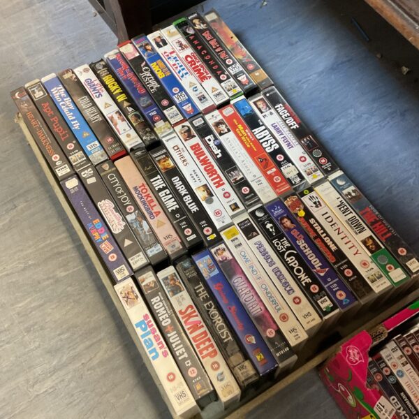 Large lot of vintage VHS cassettes for collectors and film enthusiasts.