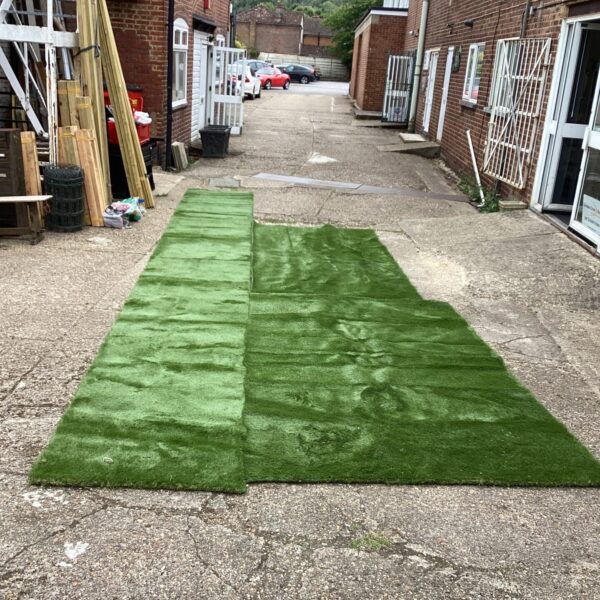 Artificial grass offcuts in a garden setting, ideal for small projects.
