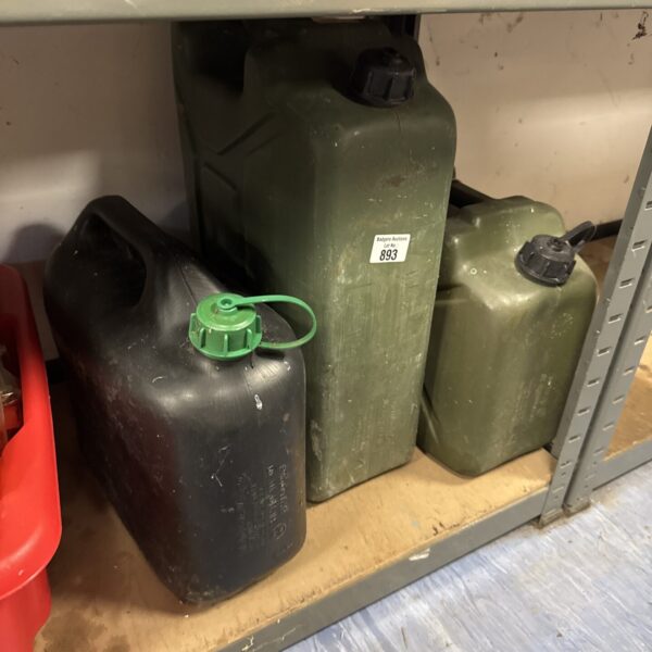 Lot of three plastic jerry cans for liquid storage.