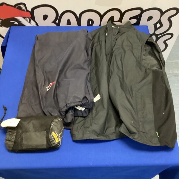 Front view of a waterproof clothing set including jacket, gilet and trousers.