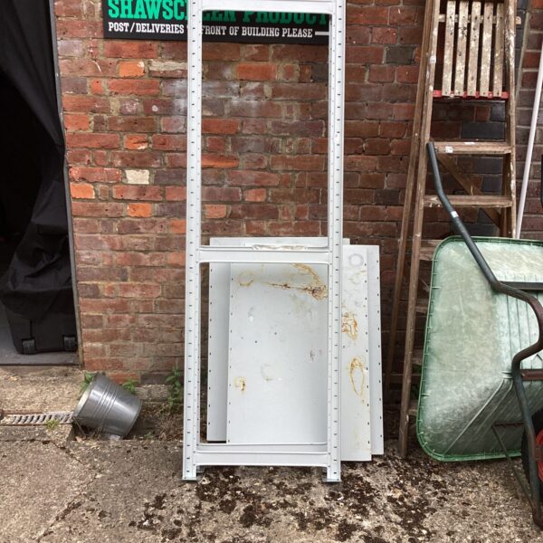 Side view of a used metal shelving unit for storage.