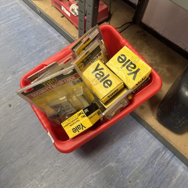 Selection of new Yale door hardware in original packaging.