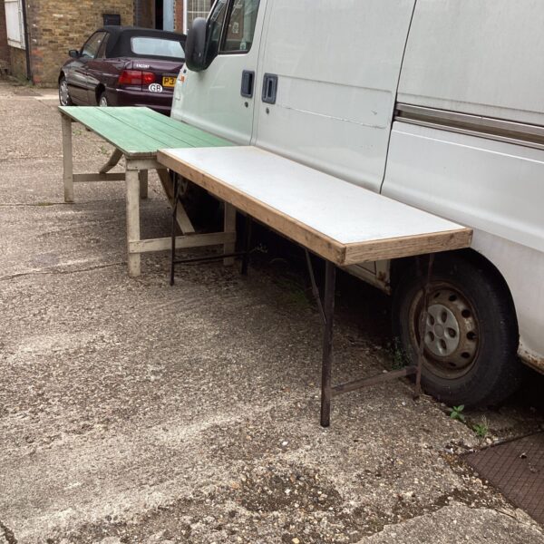 Heavy duty folding work table in a garage setting.