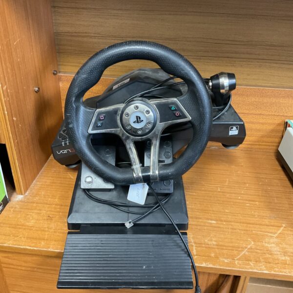 Black and silver Venom PlayStation racing wheel for gaming.