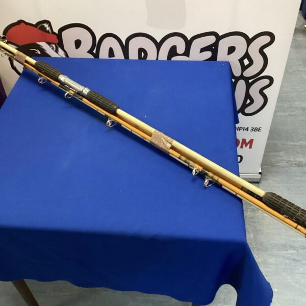 Vintage fishing rod pair, including Edgar Sealey sea rod.