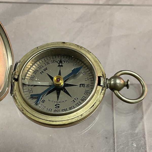 Close-up of vintage Wittnauer compass showing the face and needle.