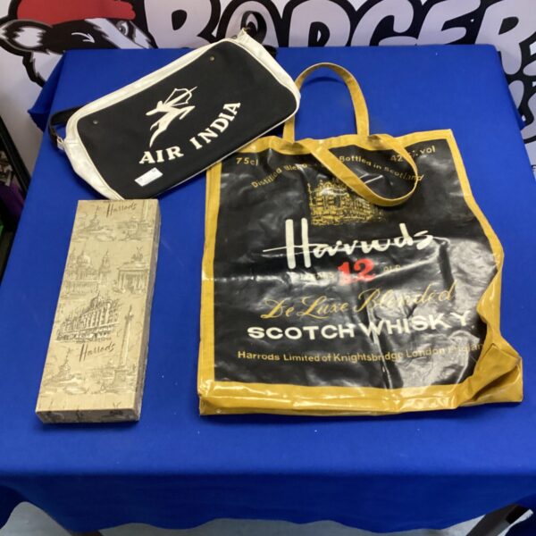 Vintage Harrods collectibles lot including a whisky bag and tie box.