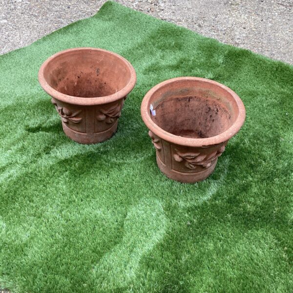 Pair of vintage terracotta garden pots for outdoor plants.