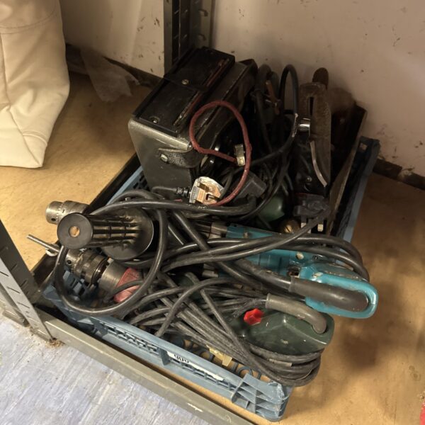 Tray of assorted power tools including a drill and avometer.