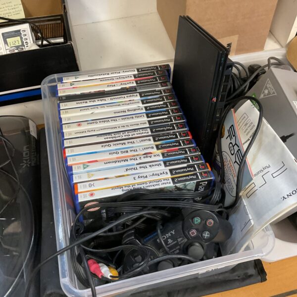 PlayStation 2 slim console with games and dance mat