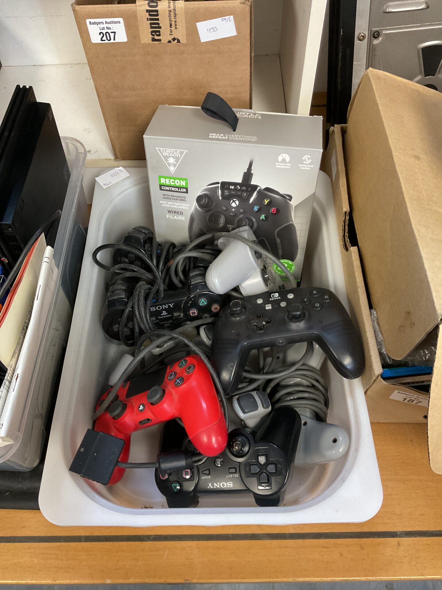 211 Box of gaming controllers inc Nintendo switch & ps4