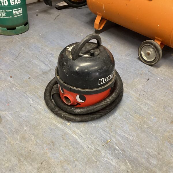 Red Numatic Henry vacuum cleaner, vintage cleaning appliance.