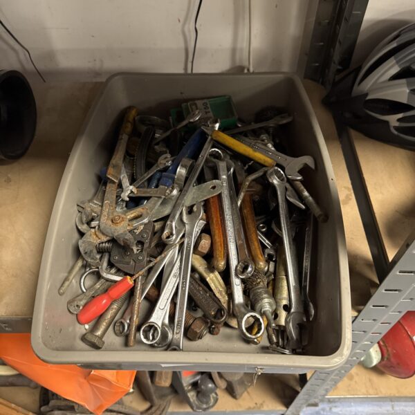 Tray of assorted spanners and wrenches for garage or workshop use.