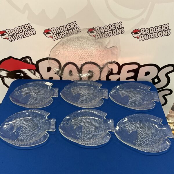 Vintage Arcoroc fish plates and serving platter set on display.