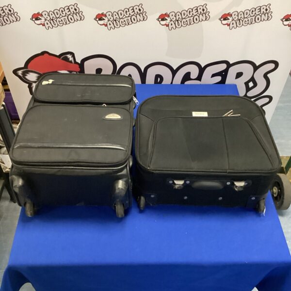 Two wheeled travel cases, a Karabar and Samsonite, with extendable handles.