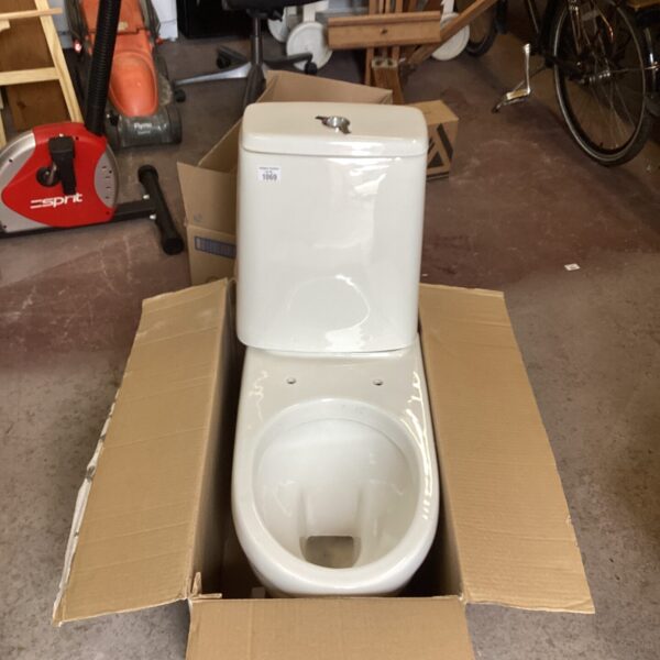 Side view of a new Atlas Trade close coupled toilet unit.