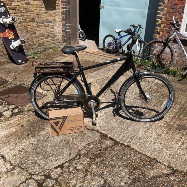 Used Selcof electric bike with charger for auction.