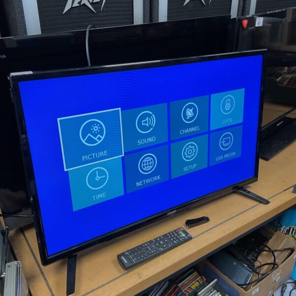 Used Linsar 32 inch HD television in a cluttered room.