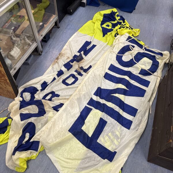 Large racetrack banners advertising the finish line and Putoline oil.